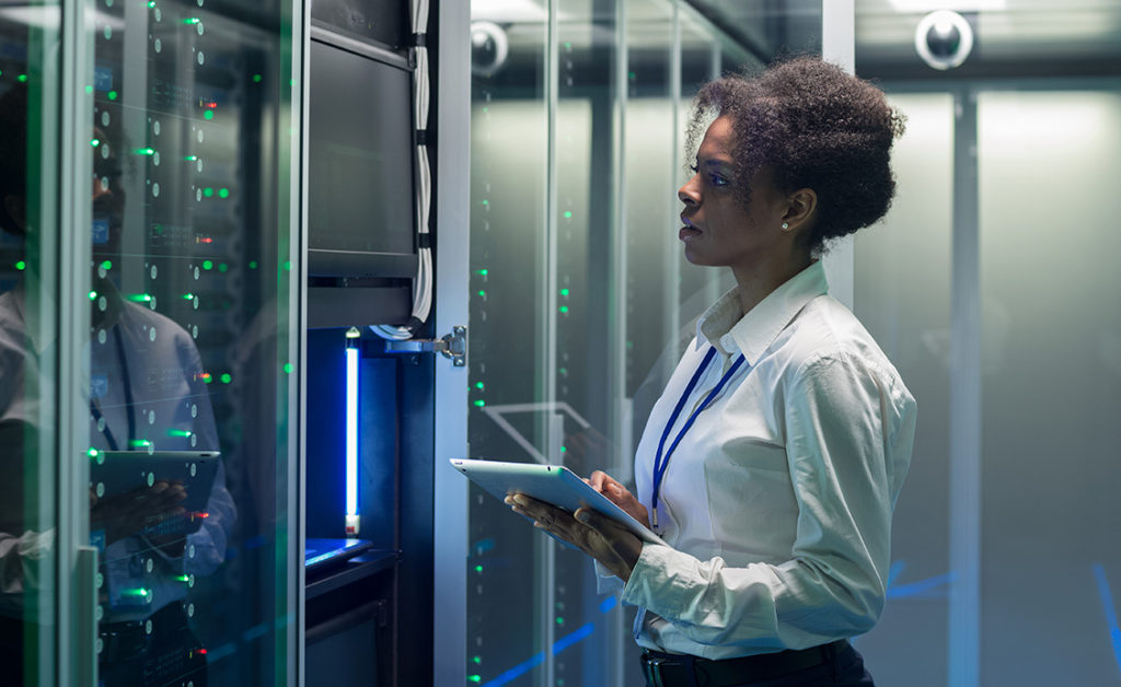 Engineers performing custom battery requirement analysis and computer modeling